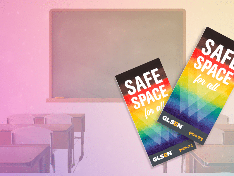 Two GLSEN Safe Space cards are in the foreground against a rainbow glistening classroom background.