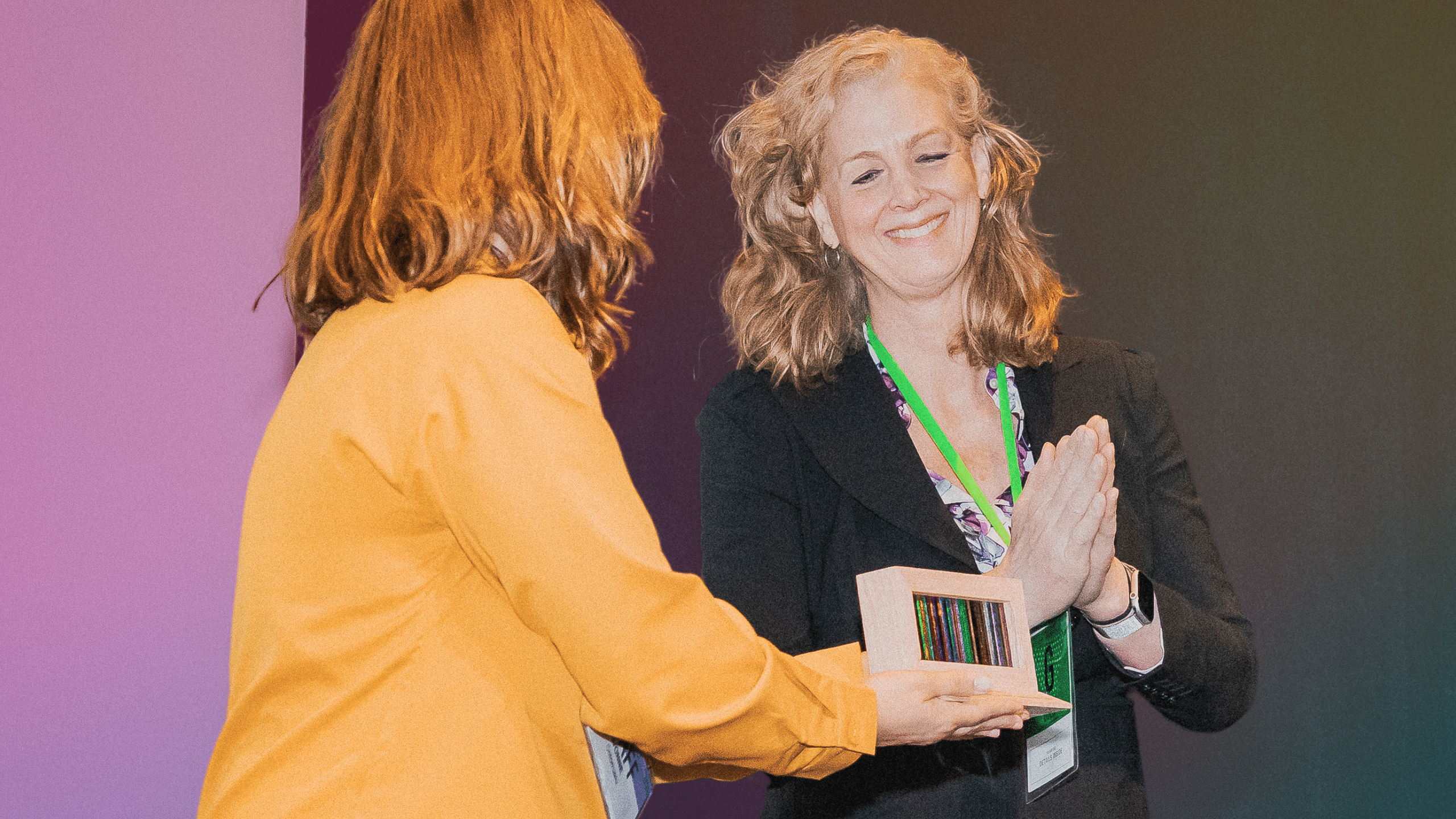 Kimberly Reed smiles as she is presented an award.